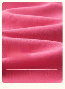 Close-up of pink cotton blend knit fabric showing soft, breathable, and wavy texture