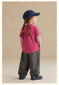 Detailed view of kids cartoon layered long sleeve t-shirt with grey wide leg casual pants