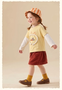 Detail of 3D cartoon cat embroidery on girls' layered long sleeve tee and corduroy skirt
