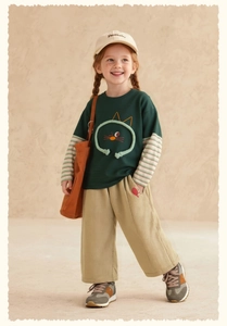 Detail of child's green long sleeve tee with 3D cat motif and khaki cotton pants