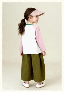 Detail of girls' casual long sleeve t-shirt and green wide-leg pants outfit set