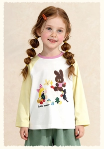 Close-up of Forest Party cartoon print and colorblock raglan sleeves on cotton tee