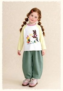 Detail of girls' long sleeve tee with Forest Party cartoon print and color blocking