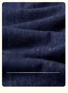 Macro shot of deep blue soft twill denim fabric with high-density weaving for kids pants
