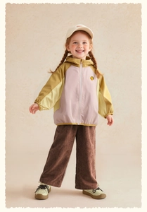 Detail of color-blocked outdoor windbreaker and corduroy pants for children's spring outfit