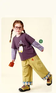 Kids spring fashion set featuring a penguin print purple tee and khaki leisure pants