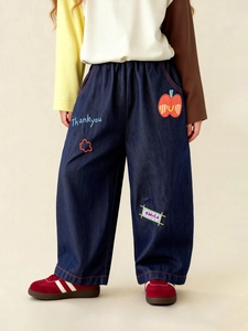 Kids wide-leg denim jeans with cartoon embroidery and patches in deep indigo blue