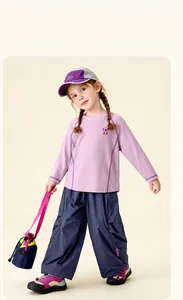 Close-up of kids lavender long sleeve tee and blue cargo pants for outdoor activities