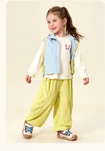 Three-piece vibrant kids set with light blue vest and green pants for casual outdoor wear