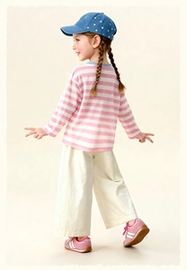 Kids spring outfit with striped shirt, off-white wide leg pants and pink sneakers