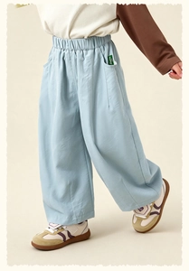 Detail view of children's light blue wide-leg casual pants with elastic waist and logo tag