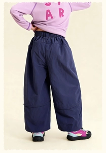Detail view of children's navy wide-leg casual pants with comfortable elastic waistband