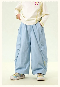 Detail of kids casual beige sweatshirt with STAR print and light blue wide-leg cargo pants
