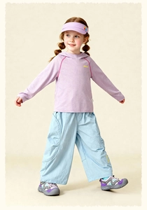 Detail of kids casual wide-leg trousers with relaxed fit and stylish knee pleats