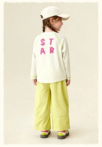 Rear view of children's white long-sleeve tee with STAR print and yellow wide-leg pants