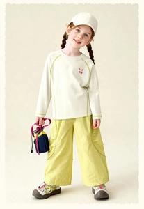 Kids casual outfit featuring white STAR print long sleeve top and green wide leg pants