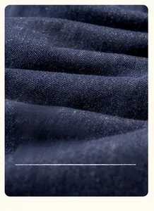 Macro shot of soft deep blue denim fabric texture and twill weave for girl's dress