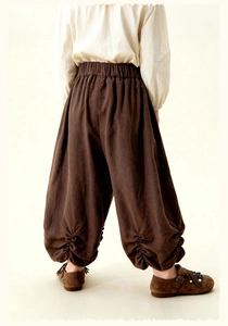 Detail of kids dark brown bloomers showing pleated cuffs and breathable cotton fabric texture