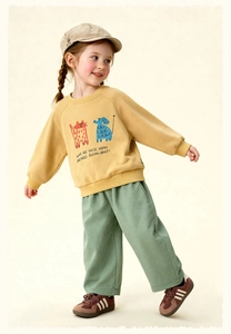 Detail view of cotton kids sweatshirt featuring cartoon cat and elephant illustrations