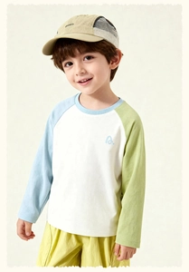 Close-up of kids' color-block raglan tee with contrast sleeves and blue logo detail