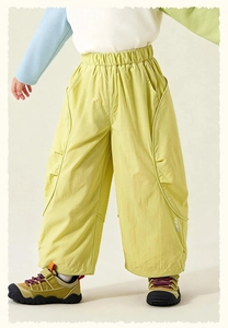 Detail of kids light green cargo pants with elastic waist and smile print