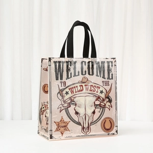 Waterproof Western themed non-woven gift bag with cow skull and sheriff star prints