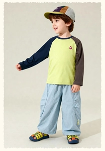 Detail shot of boy's color-block t-shirt with joggers and matching accessories