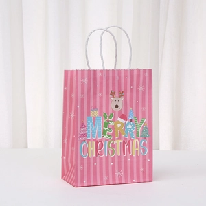 Pink Christmas kraft gift bag with reindeer print and white braided rope handles