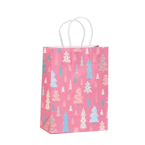 Pink Christmas kraft paper gift bag with colorful tree patterns and sturdy white handles