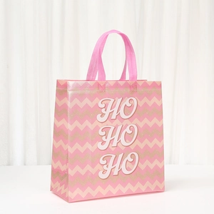 Pink Christmas non-woven gift bag with chevron pattern and HO HO HO print detail