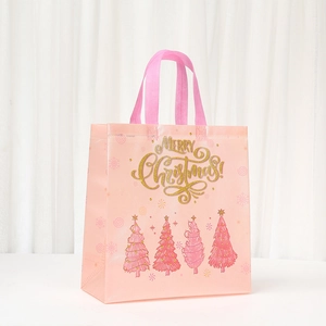 Pink Christmas non-woven gift tote bag with golden Merry Christmas text and tree patterns