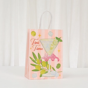 Detail of paper gift bag with Tini Time cocktail print and white rope handle
