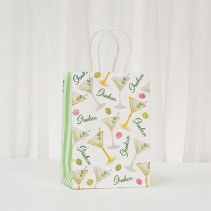 White paper gift bag with Shaken cocktail martini print and white twisted rope handles