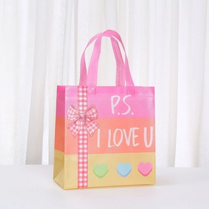 Valentine non-woven gift bag with P.S. I LOVE U text and pink checkered bow accent