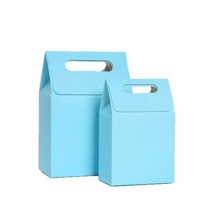 Set of two light blue matte cardstock gift boxes with integrated handles on white background