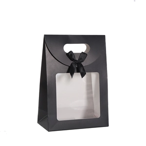 Solid black matte gift paper bag with clear window and ribbon bow handle for pastries