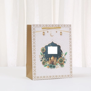 Eid Mubarak paper gift bag with moon and mosque print with golden woven handles