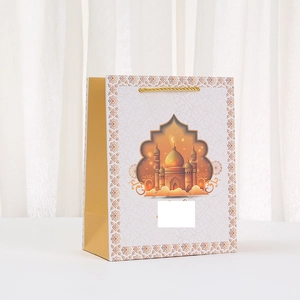 Eid Mubarak gift bag with gold mosque print and sturdy rope handle for festive packing