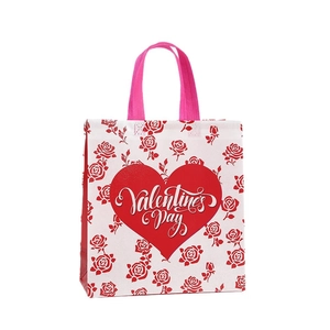 Pink Valentine's Day shopping bag with red roses and heart logo in non-woven fabric