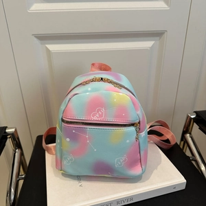 Pastel gradient mini backpack with heart print and love text on white books