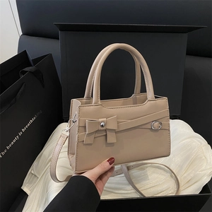 Beige bow knot handbag with adjustable shoulder strap and premium PU leather texture
