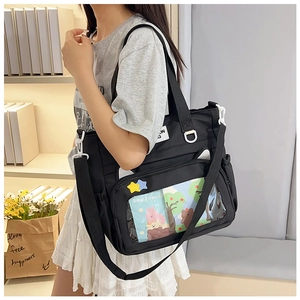 Nylon tote bag with transparent PVC window and adjustable strap shown on model