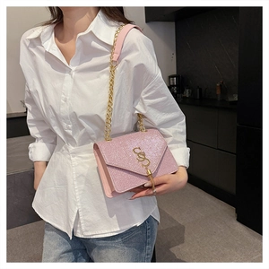 Pink sequin crossbody bag with gold chain strap and letter S fringe clasp detail
