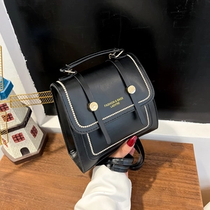 Minimalist black PU leather backpack and crossbody bag with silver rivet trim