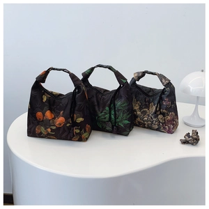 Three Chinese style printed handbags with floral patterns and buckle handle detail