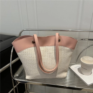 Pink leather and woven straw tote bag for beach vacations and daily commute style