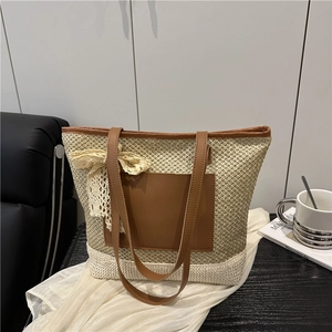 Woven straw tote bag with brown leather pocket and lace bow for summer beach vacations