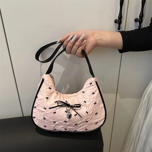 Pink bow underarm bag with sweet pleated texture and stylish black leather shoulder straps