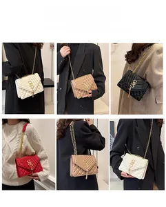 Detailed view of quilted PU leather bags with gold chain straps and metal tassel accents