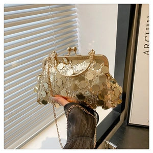 Detailed macro view of vintage gold clasp and sequin texture on the elegant evening bag